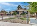 A cozy home featuring desert landscaping and a small outdoor seating area at 4739 Glenndavis Dr, Las Vegas, NV 89121