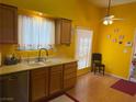 Bright kitchen with laminate floor, window and ample counter space and appliances at 4833 Lawnwood Ct, Las Vegas, NV 89130