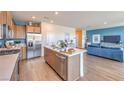 Open concept kitchen with stainless steel appliances, a center island, and modern wood cabinets at 551 Ruby Robin Ave # Lot 750, Henderson, NV 89011