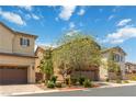 Charming two-story home with a two car garage and beautiful landscaping in a suburban neighborhood at 7345 Chesapeake Cove St, Las Vegas, NV 89166