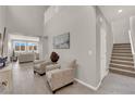 Bright entryway with high ceilings, tile flooring, and staircase at 872 Pointe Arbor St, Henderson, NV 89011
