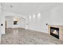 Spacious living area boasting a modern fireplace and hardwood flooring, perfect for entertaining guests at 8725 W Flamingo Rd # 110, Las Vegas, NV 89147