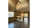 Spacious living room with a neutral paint color, tile floors and lots of light at 9145 Sunken Meadow Ave, Las Vegas, NV 89178