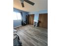 Bedroom featuring a ceiling fan, neutral walls, and ample closet space at 105 Huntly Rd, Las Vegas, NV 89145