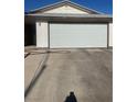 Picture of garage with large white door and big concrete driveway at 105 Huntly Rd, Las Vegas, NV 89145