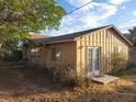 Side view of a cozy single-story home featuring a small yard at 165 W Alma Ave, Overton, NV 89040