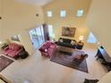 Open living space with high ceilings and a view of the backyard patio at 2033 Summer Spruce Pl # 102, Las Vegas, NV 89134