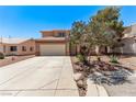 Charming two-story home with a two-car garage and low maintenance front yard landscaping at 2037 Merano Ct, Las Vegas, NV 89123