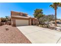 Lovely two-story home with a two-car garage, manicured landscaping, and a welcoming entrance at 2037 Merano Ct, Las Vegas, NV 89123