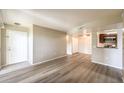 Open concept living space with hardwood floors, providing seamless flow to the front door and kitchen at 2120 Ramrod Ave # 2216, Henderson, NV 89014