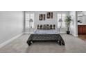 Comfortable bedroom with neutral carpet, natural light, and minimalist decor at 2271 Smokey Sky Dr, Henderson, NV 89052