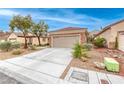 Charming single-story home featuring a well-kept front yard, two-car garage, and inviting curb appeal at 2522 Darda St, Henderson, NV 89044
