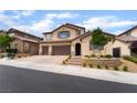 Charming two-story stucco home features a three-car garage and well-manicured landscaping at 2575 Hazelburn Ave, Henderson, NV 89044