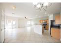 Spacious living area featuring tile flooring and a seamless transition into the kitchen at 3312 Speckle Summer Pl # 3, North Las Vegas, NV 89084