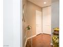 Stylish entryway with a decorative table, large mirror, and hardwood floors at 35 E Agate Ave # 208, Las Vegas, NV 89123