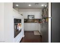 Bright kitchen with stainless steel appliances, white cabinets, and dark hardwood flooring at 35 E Agate Ave # 208, Las Vegas, NV 89123