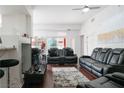 Spacious living room with sleek, modern furniture and large windows at 35 E Agate Ave # 208, Las Vegas, NV 89123