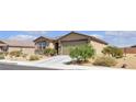 Single story home with desert landscaping and a two car garage at 3964 E Marathon Dr, Pahrump, NV 89061