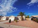 Lovely single-story home featuring a two-car garage and desert-style landscaping at 4704 Wild Oak Way, North Las Vegas, NV 89031