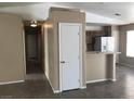 View into the kitchen with breakfast bar and white refrigerator at 4704 Wild Oak Way, North Las Vegas, NV 89031
