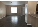 Neutral living room with tile flooring, and large window for natural light at 4704 Wild Oak Way, North Las Vegas, NV 89031