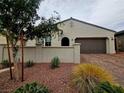 Well-maintained single-story home with desert landscaping and a two-car garage at 782 Omaggio Pl, Henderson, NV 89011