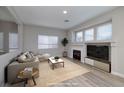Inviting living room features a fireplace, recessed lighting, and a neutral color palette at 7836 Pinnochio Ave, Las Vegas, NV 89131