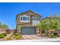 Inviting two-story home featuring a well-manicured front yard and charming architectural details at 9208 S Park St, Las Vegas, NV 89178