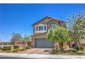 Inviting two-story home featuring a well-manicured front yard and charming architectural details at 9208 S Park St, Las Vegas, NV 89178