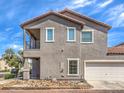 Two-story home with a two-car garage and an exterior side porch at 982 Sable Chase Pl, Henderson, NV 89011