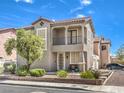Charming home featuring a second story porch, desert landscaping, and brick driveway at 982 Sable Chase Pl, Henderson, NV 89011