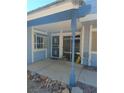 Charming front entry featuring a secure screen door and a covered porch for added curb appeal at , Las Vegas, NV 89122
