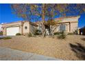 Single-story house featuring desert landscaping and inviting curb appeal at 10628 Mission Lakes Ave, Las Vegas, NV 89134
