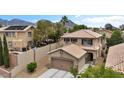 Attractive two-story home with desert landscaping, a two-car garage, and a tile roof at 10952 Napa Ridge Dr, Las Vegas, NV 89144