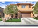 Attractive two-story home featuring a well-manicured front lawn and a two-car garage at 1272 Olivia Pkwy, Henderson, NV 89011