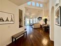Spacious living room with high ceilings, hardwood floors, and abundant natural light, perfect for entertaining at 1704 Cordoba Canyon St, Las Vegas, NV 89117