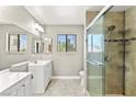 Updated bathroom with a glass-enclosed shower and dual sink vanity at 2062 Club Crest Way, Henderson, NV 89014