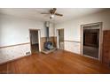 Spacious living room with hardwood floors, a fireplace, and entryways to other rooms at 26 Avenue B, McGill, NV 89318