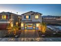 Beautiful home showcasing a well-manicured front yard and a welcoming entrance with blue door at 2630 Begonia Falls Ave # 37, North Las Vegas, NV 89081