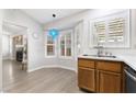 Kitchen breakfast nook with a bright bay window and modern stainless steel sink fixtures at 3157 Capetown Way, Las Vegas, NV 89128