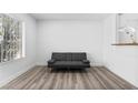 Bright living room featuring a comfortable sofa and modern flooring at 3923 Gogo Way # 106, Las Vegas, NV 89103