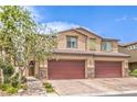Inviting townhome with a brick driveway and well-maintained landscaping at 4212 Juanita May Ave, North Las Vegas, NV 89032