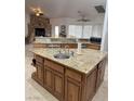 Open kitchen featuring a large island, granite countertops, and stainless steel appliances at 425 Ross Ave, Overton, NV 89040