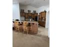 Kitchen with wood cabinetry, a breakfast bar, and modern appliances at 425 Ross Ave, Overton, NV 89040