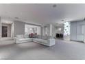Spacious open-concept living room with neutral color palette leading to the dining and kitchen areas at 4575 Dean Martin Dr # 2607, Las Vegas, NV 89103