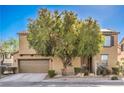 Inviting home featuring desert landscaping with a large tree offering shade and curb appeal at 5232 Pendergrass St, North Las Vegas, NV 89081