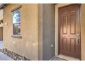 Close-up view of front door with sidelight and well-maintained exterior at 5232 Pendergrass St, North Las Vegas, NV 89081