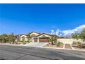 Beautiful single story home featuring a desert landscaped yard and a three-car garage at 5855 Boulder Brook Ct, Las Vegas, NV 89149