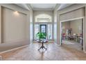 Inviting foyer boasts tile flooring, high ceilings, and a view into adjacent rooms at 5855 Boulder Brook Ct, Las Vegas, NV 89149
