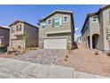 View of two-story home showing the driveway and minimal landscaping at 9086 Nostrand Ave, Las Vegas, NV 89148